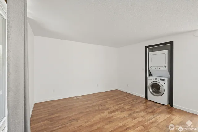 a view of a storage & utility room with a washer dryer