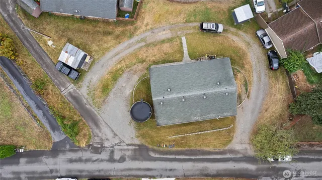 an aerial view of a house with a yard