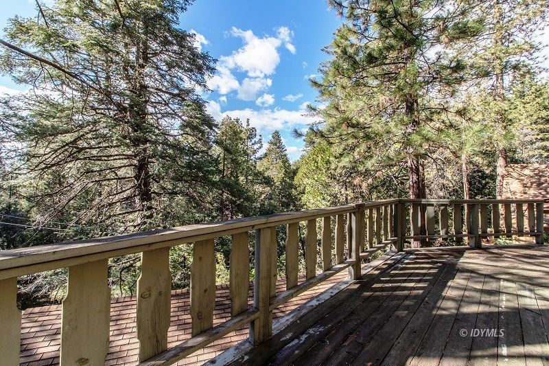 25390 Shadow Oaks Idyllwild, CA 92549 - Photo 22 of 39 a view of a wooden balcony with trees
