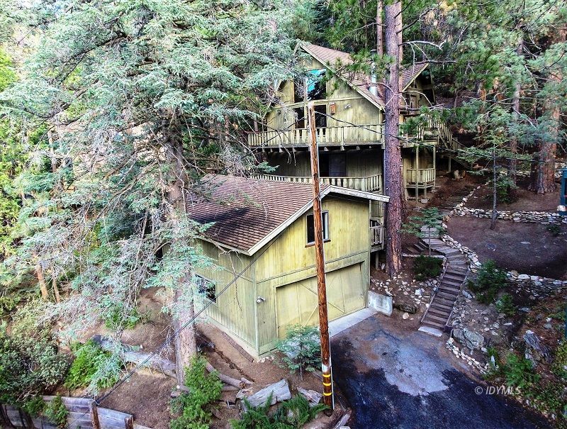 25390 Shadow Oaks Idyllwild, CA 92549 - Photo 38 of 39 a yellow and red house with a tree in the background