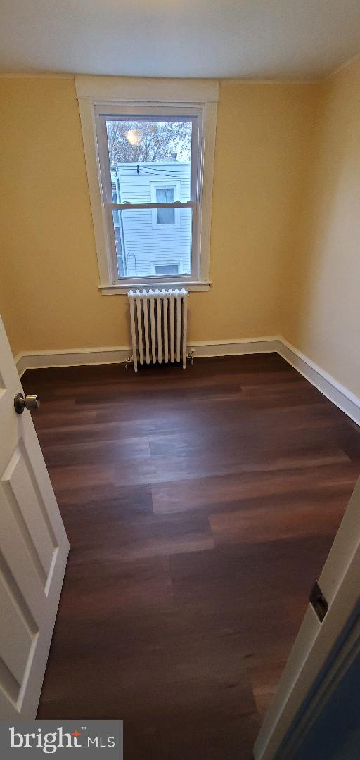 7220 Lamport Road Upper Darby, PA 19082 - Photo 11 of 14 a view of an empty room with wooden floor and a window