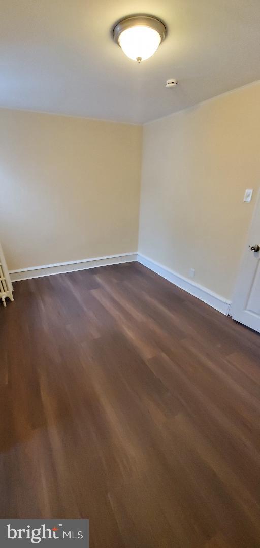7220 Lamport Road Upper Darby, PA 19082 - Photo 10 of 14 a view of an empty room with wooden floor