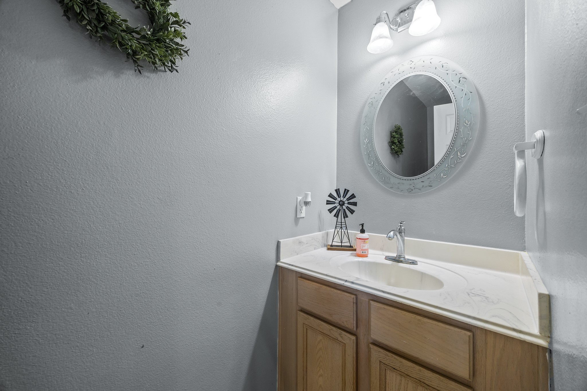6503 County Road 208 Angleton, TX 77515 - Photo 16 of 38 a bathroom with a sink and a mirror