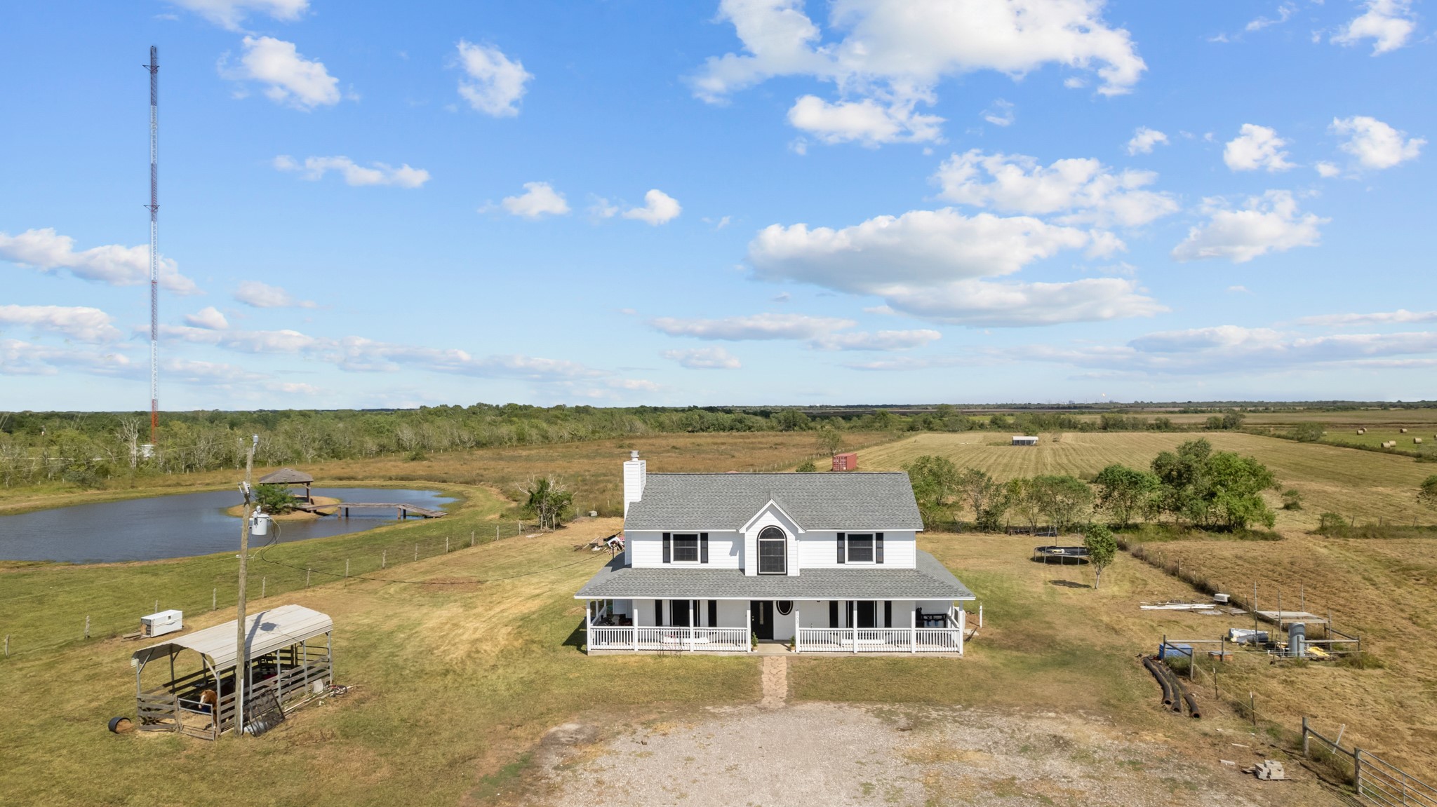 6503 County Road 208 Angleton, TX 77515 - Photo 2 of 38 a view of a lake with houses in the back