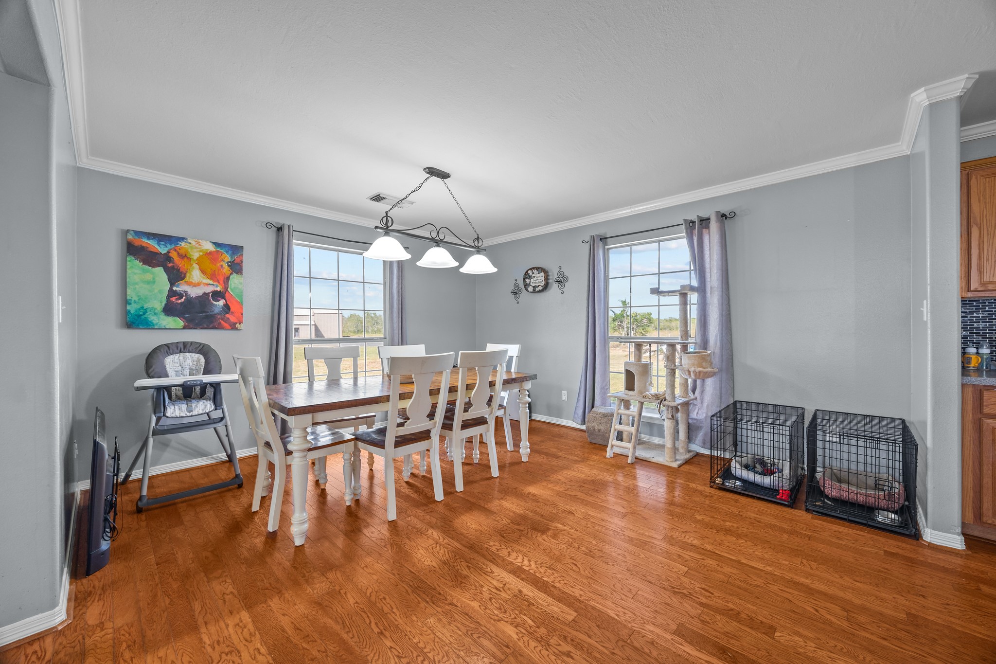 6503 County Road 208 Angleton, TX 77515 - Photo 7 of 38 a view of a dining room with furniture a chandelier and wooden floor