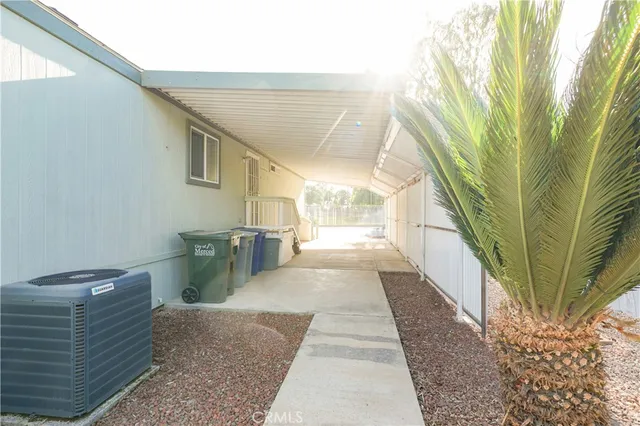 a view of a patio with couches and potted plants