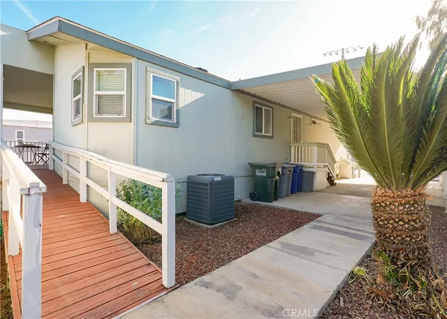 a view of a house with wooden stairs