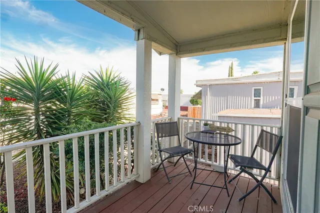 a view of a balcony with furniture