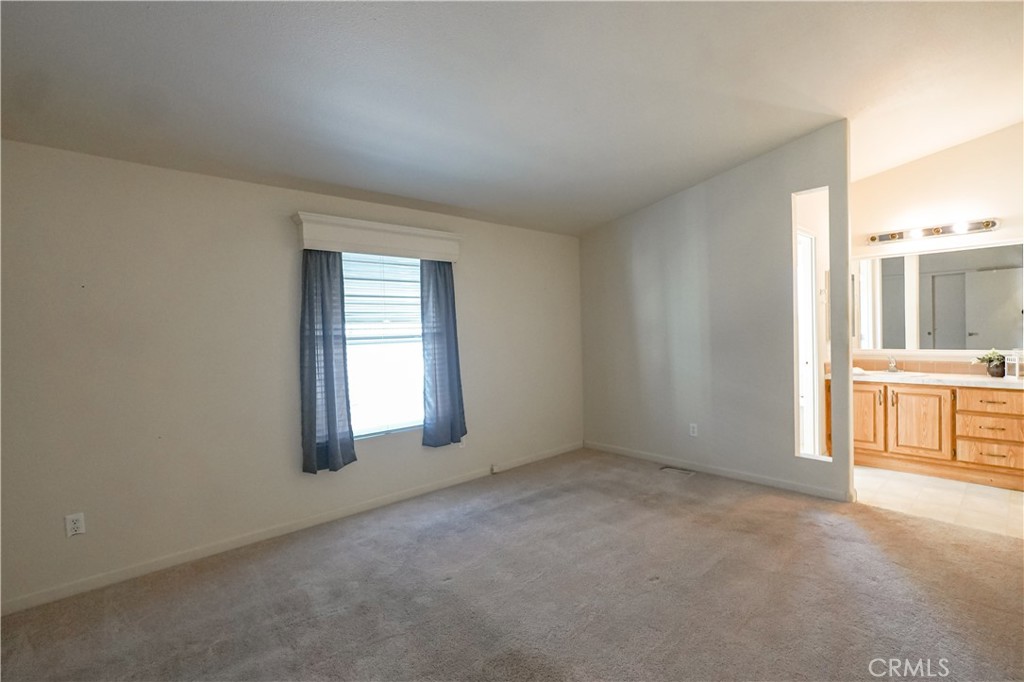 2240 Golden Oak Lane, Unit 147 Merced, CA 95341 - Photo 8 of 20 a view of a room with a sink and a window