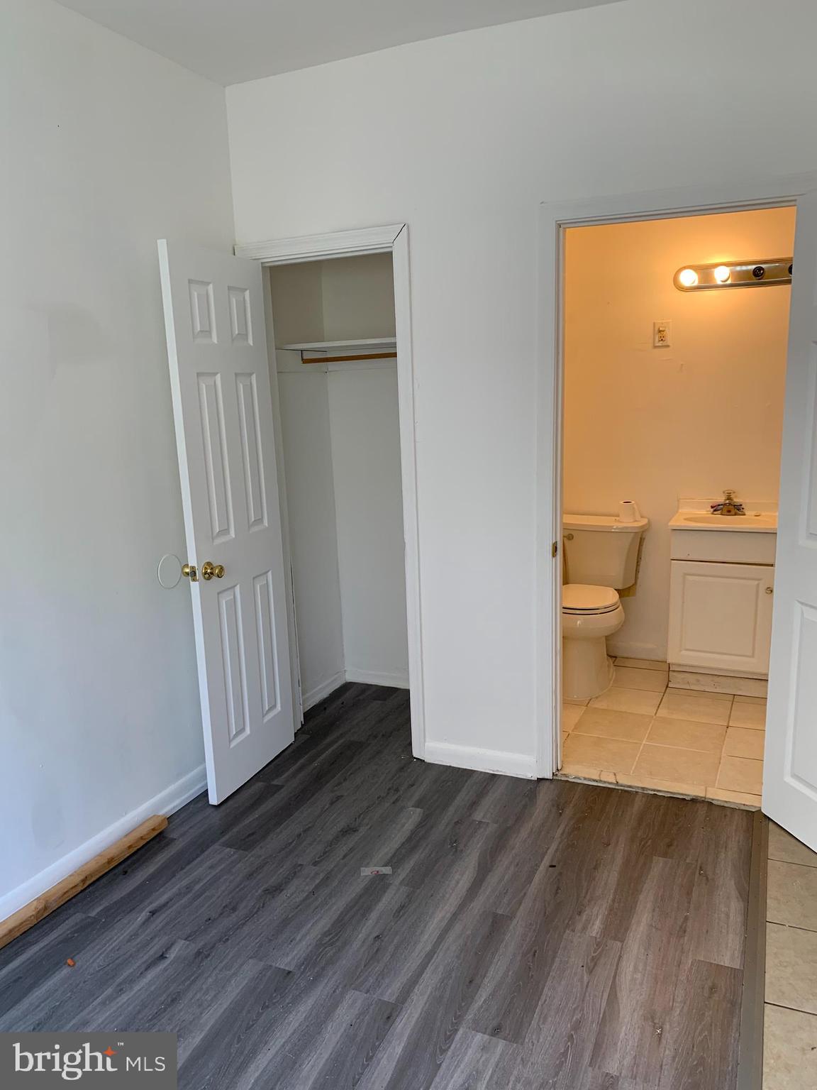 65-69 High Street, Unit 3 Mount Holly, NJ 08060 - Photo 4 of 10 an empty room with wooden floor and a bathroom