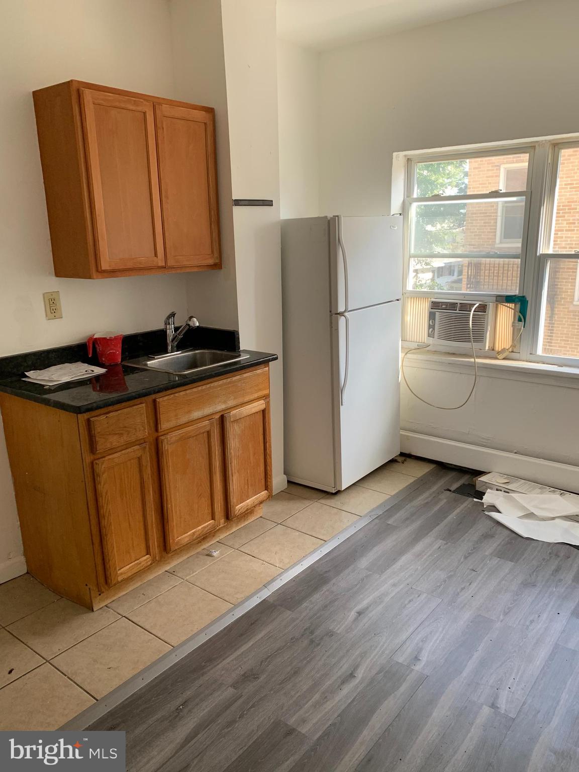 65-69 High Street, Unit 3 Mount Holly, NJ 08060 - Photo 5 of 10 a kitchen with stainless steel appliances granite countertop a stove a sink and a refrigerator