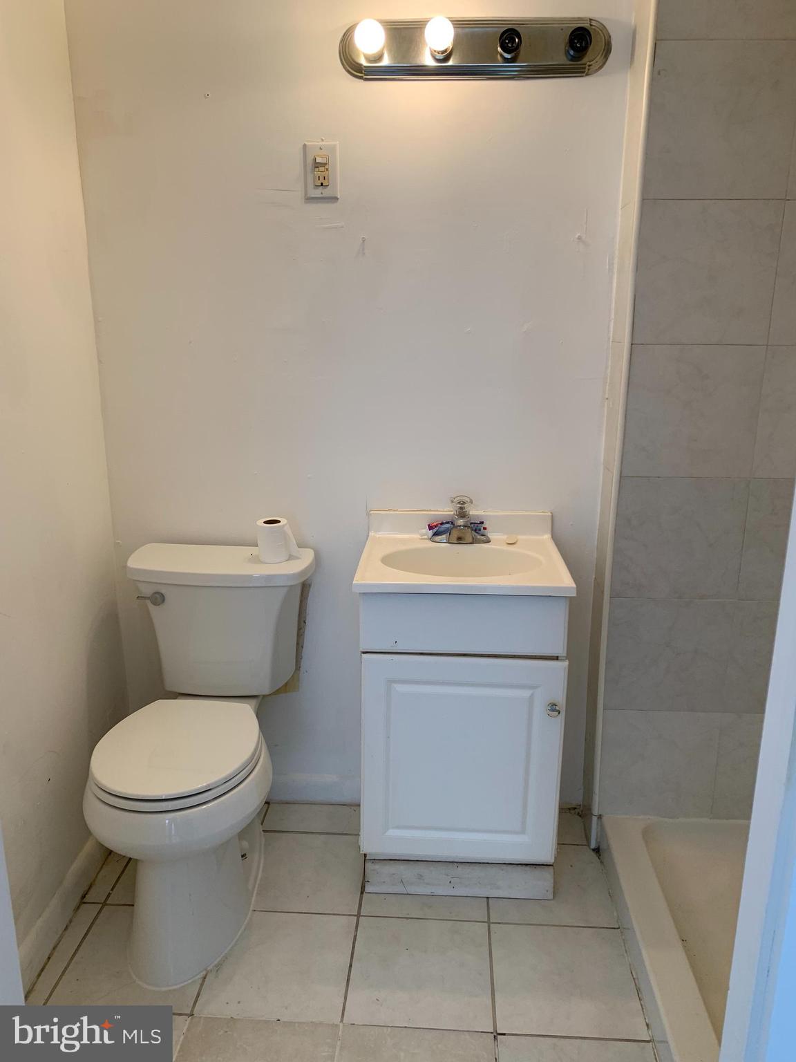 65-69 High Street, Unit 3 Mount Holly, NJ 08060 - Photo 8 of 10 a bathroom with a sink toilet and a mirror
