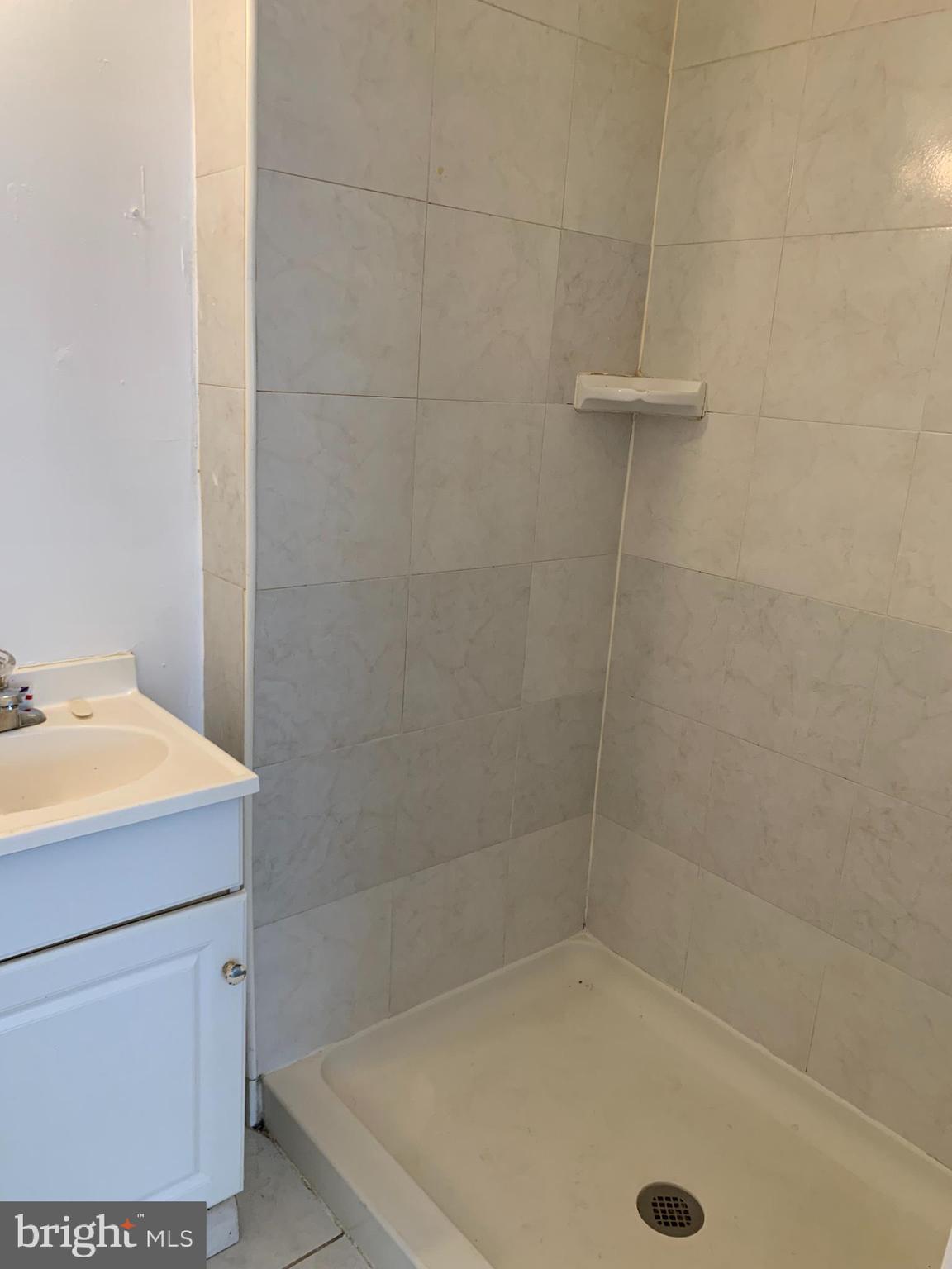 65-69 High Street, Unit 3 Mount Holly, NJ 08060 - Photo 10 of 10 a bathroom with a sink a toilet and shower