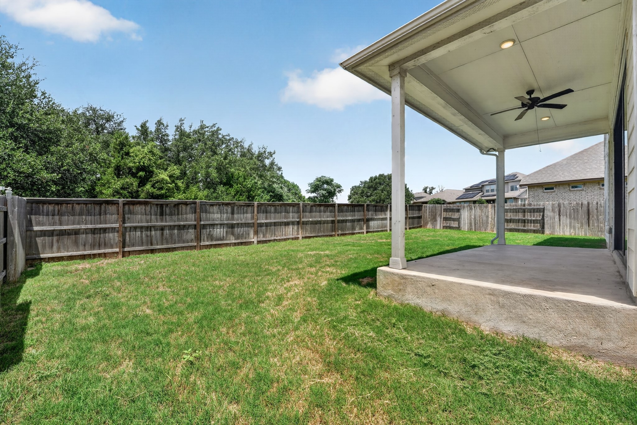 508 Pinnacle View Drive Georgetown, TX 78628 - Photo 25 of 27 Unwind in the generous backyard with a covered patio, ideal for outdoor gatherings.