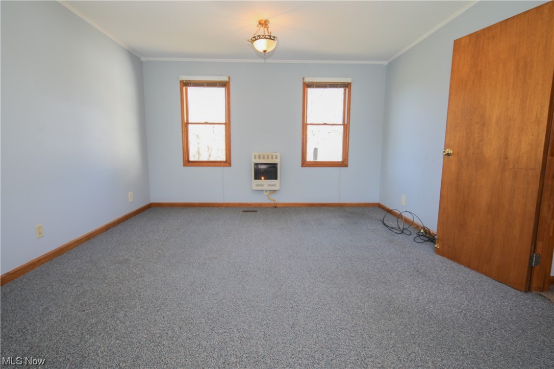 36671 Conner Ridge Road Woodsfield, OH 43793 - Photo 23 of 36 Carpeted empty room featuring crown molding
