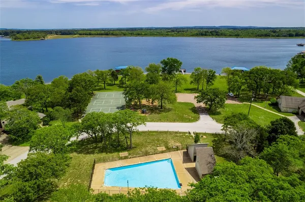 an aerial view of a house with a lake view