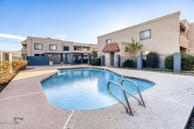 a view of a living room and kitchen