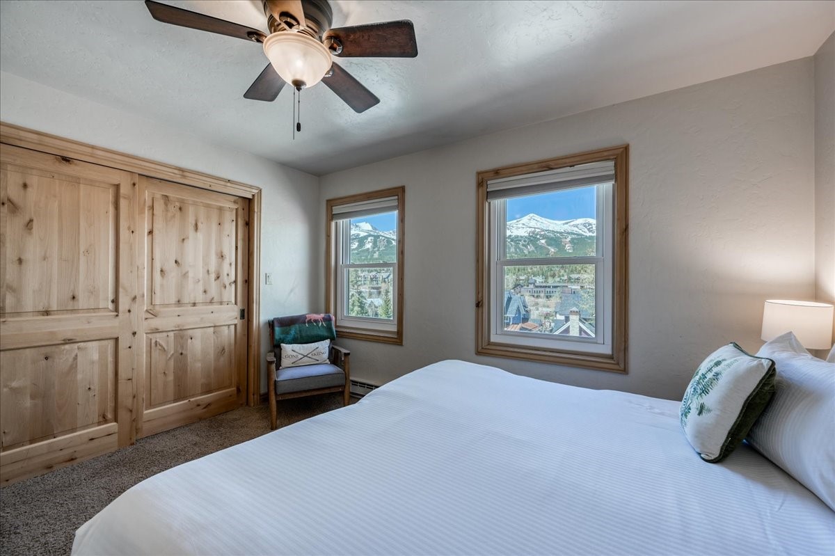 200 North Ridge Street, Unit R A Breckenridge, CO 80424 - Photo 24 of 38 a bedroom with a bed and a chandelier