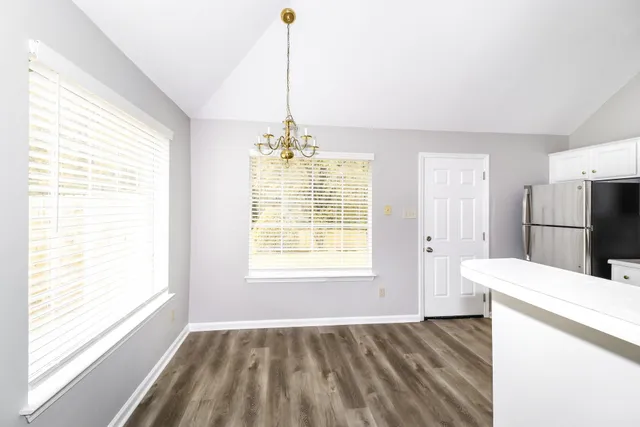 a view of an empty room with a window