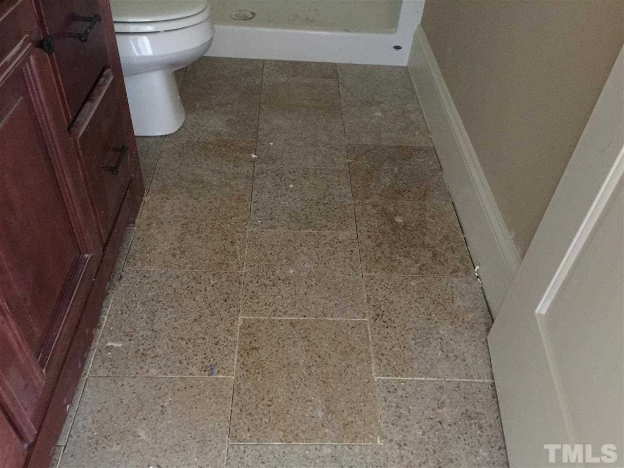6901 Spanglers Spring Way Raleigh, NC 27610 - Photo 24 of 25 Custom tile in Kitchen, laundry area & all bathrooms