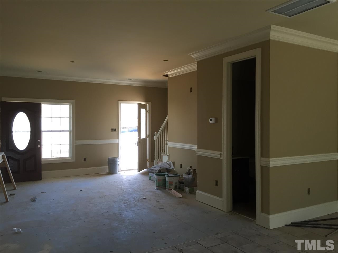 6901 Spanglers Spring Way Raleigh, NC 27610 - Photo 4 of 25 Living room & half downstairs bath