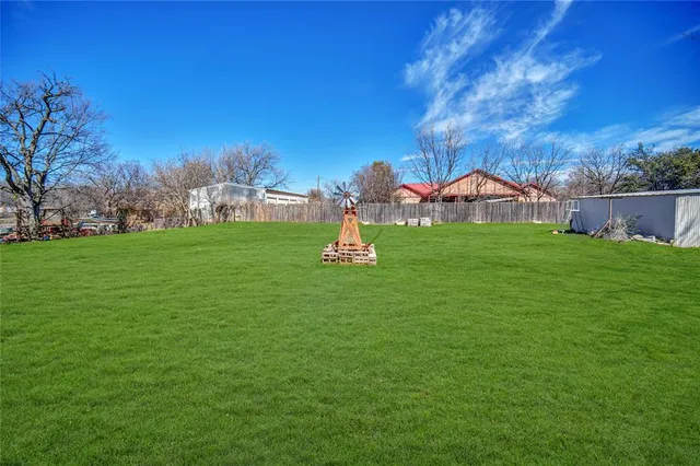 a fire hydrant in the middle of a field