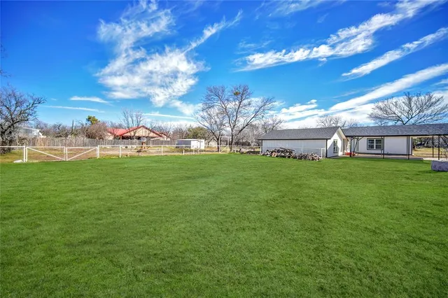 a view of a house with a big yard