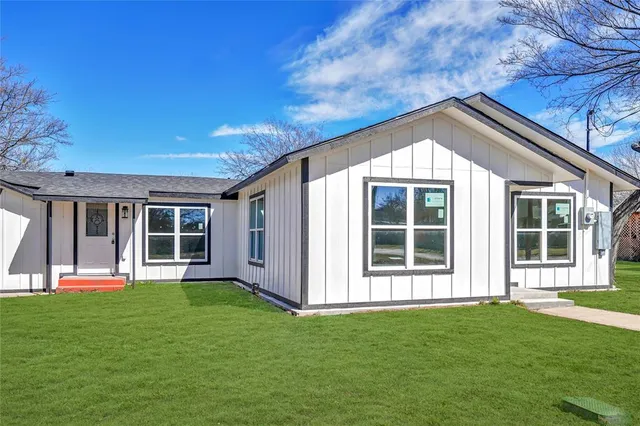 front view of a house with a yard