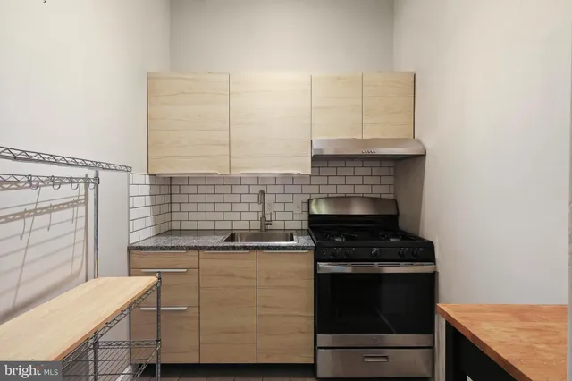 a kitchen with cabinets and appliances
