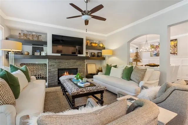 a living room with furniture and a fireplace