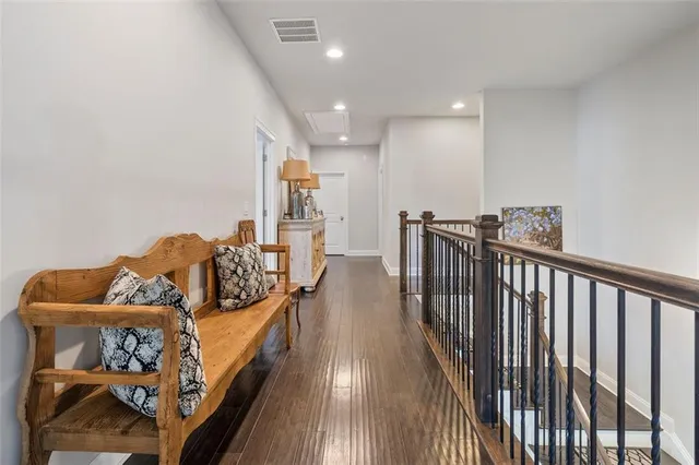 a bedroom with a bed a couch and a window