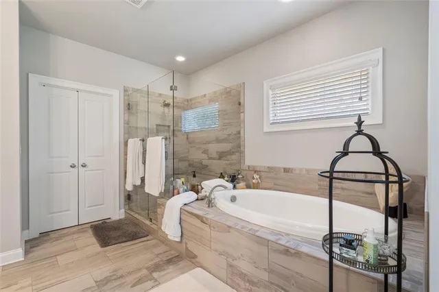 a bedroom with bed and a night stand