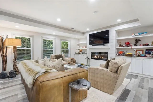 a kitchen with counter top space a sink cabinets and stainless steel appliances