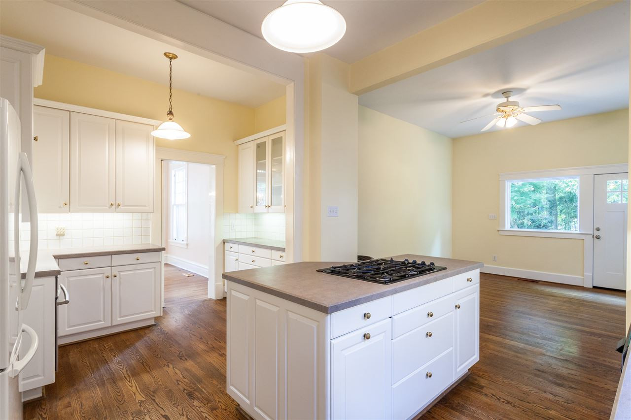 117 Forest Road Raleigh, NC 27605 - Photo 9 of 30 Gas Cooktop, Central Island, and Granite Counters Kitchen