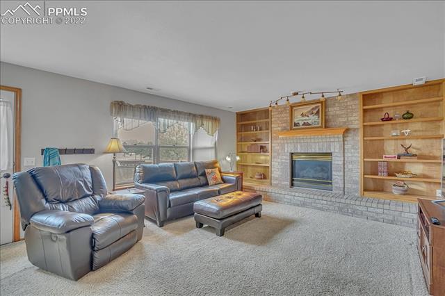7829 French Road Colorado Springs, CO 80920 - Photo 22 of 30 Family room with cozy gas fireplace.
