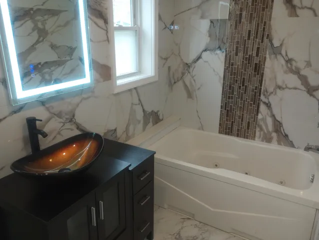 a bathroom with a sink and bathtub
