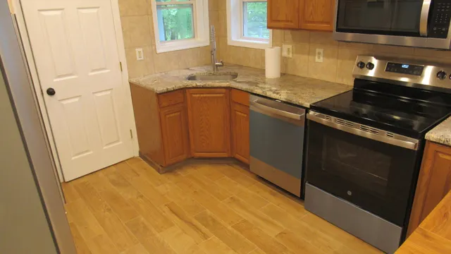 a kitchen with a refrigerator a stove and a sink