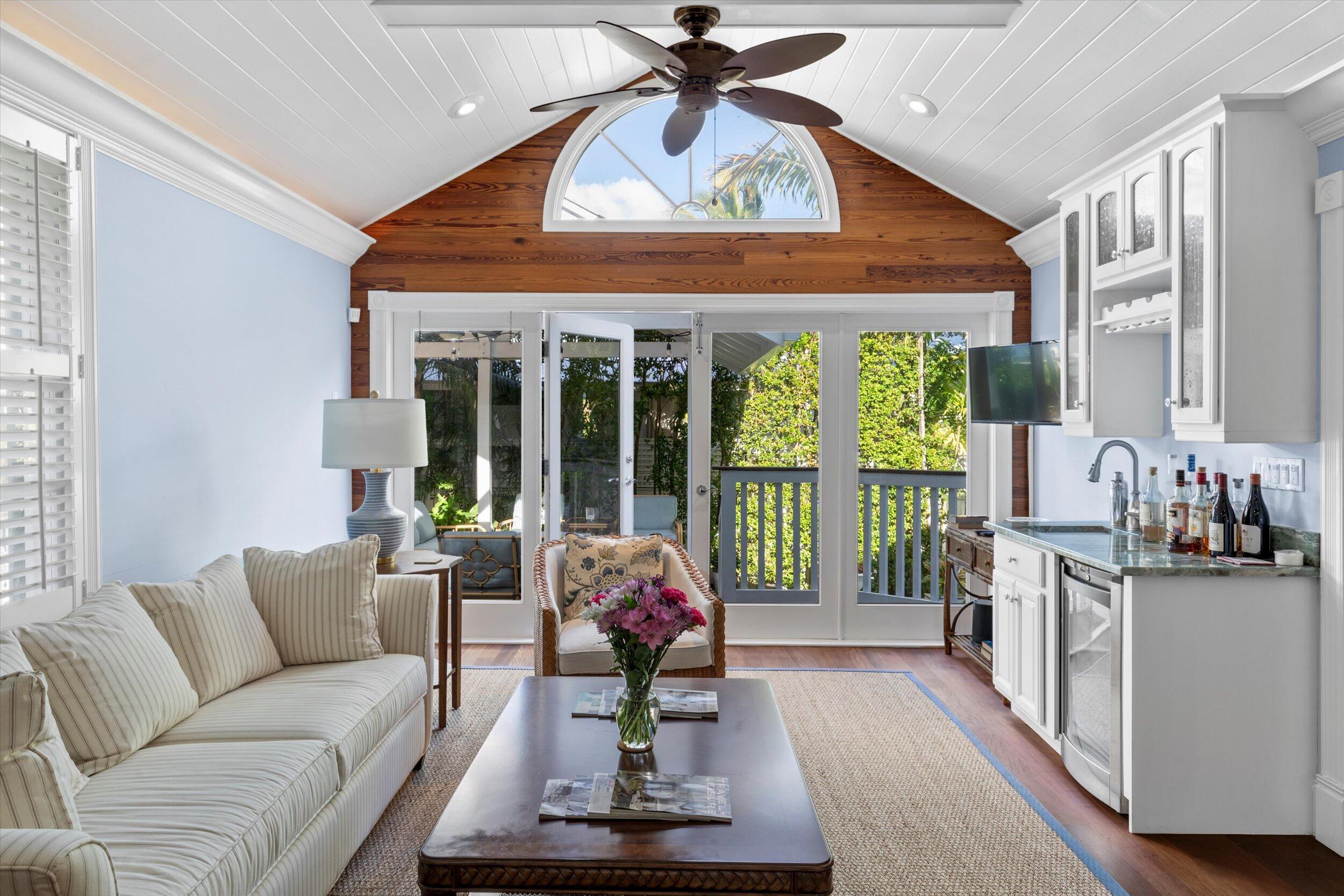 709 Eaton Street Key West, FL 33040 - Photo 10 of 37 a living room with furniture and a large window