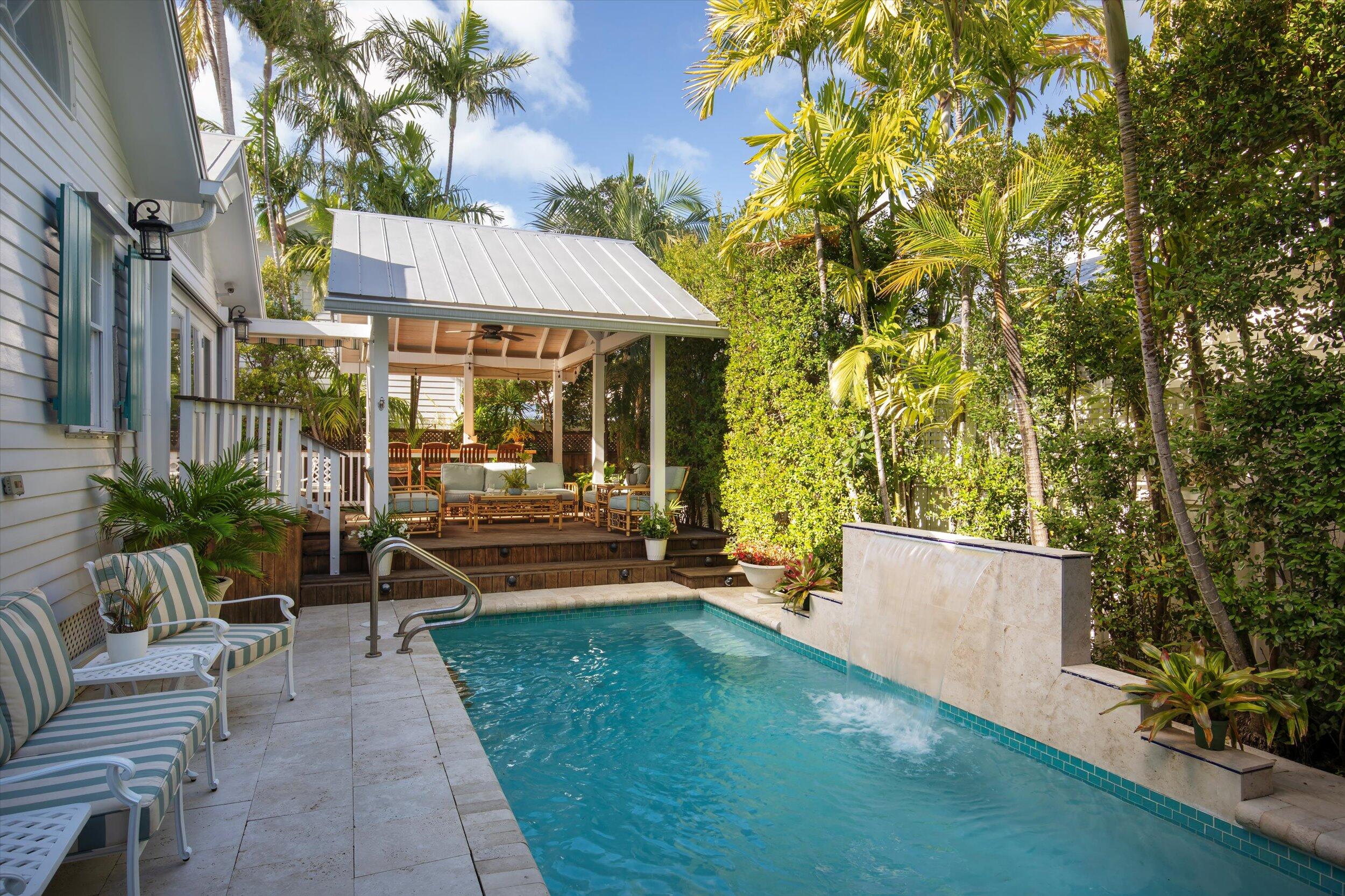 709 Eaton Street Key West, FL 33040 - Photo 13 of 37 front view of a house with a yard