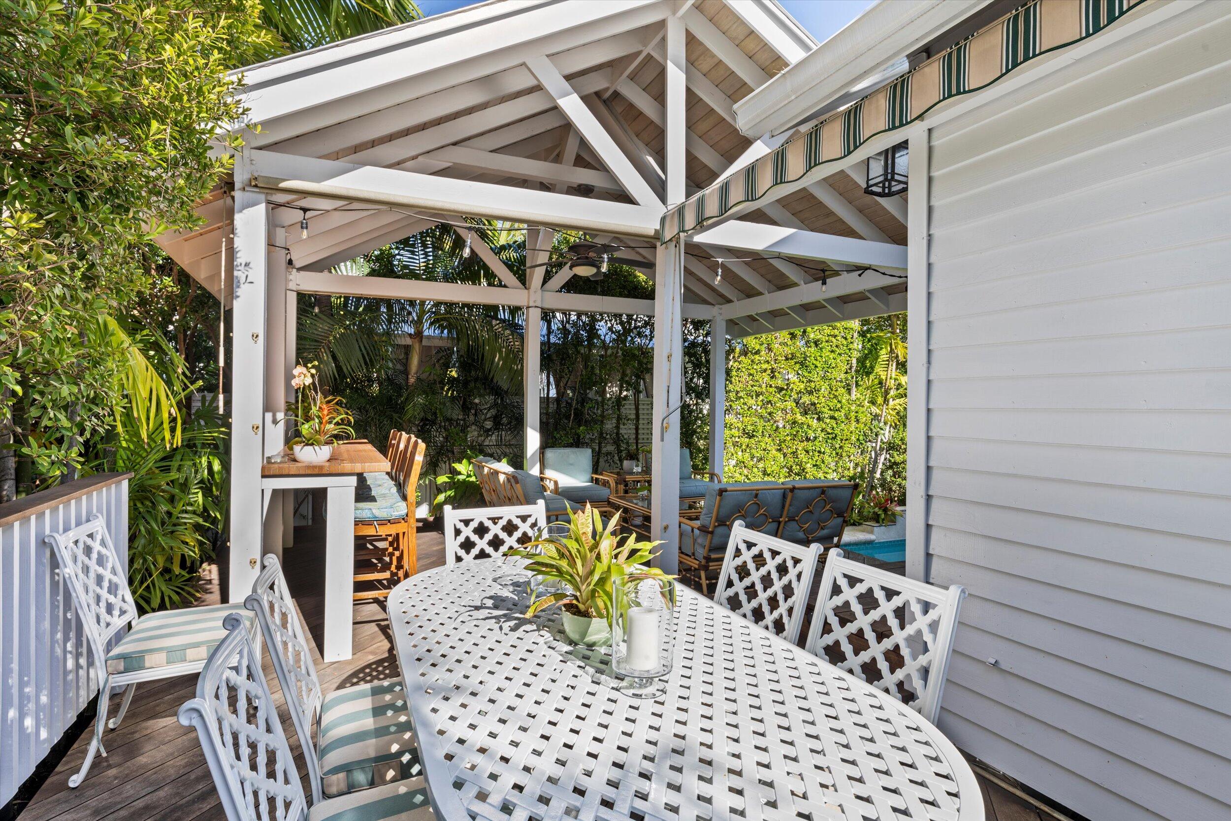 709 Eaton Street Key West, FL 33040 - Photo 17 of 37 a view of outdoor dining space with a table and chairs