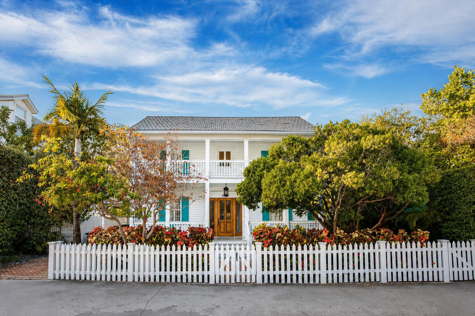 709 Eaton Street Key West, FL 33040 - Photo 2 of 37 a view of a house with a small yard and wooden fence