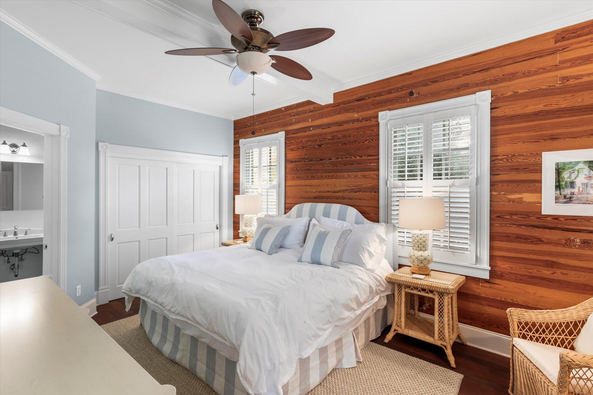 709 Eaton Street Key West, FL 33040 - Photo 22 of 37 a bedroom with a bed and a chandelier