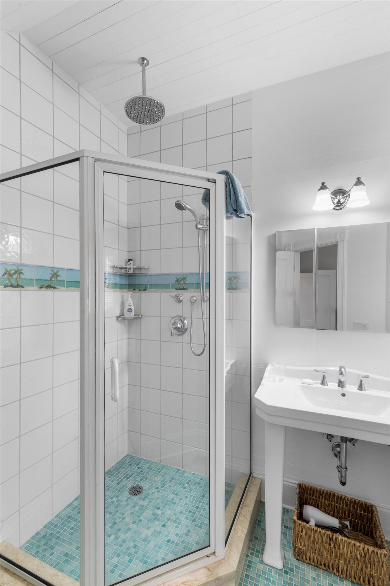 709 Eaton Street Key West, FL 33040 - Photo 22 of 37 a bathroom with a sink a shower and a mirror