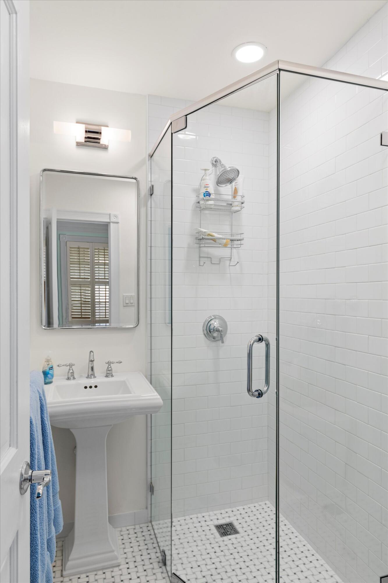 709 Eaton Street Key West, FL 33040 - Photo 25 of 37 a bathroom with a shower sink and mirror