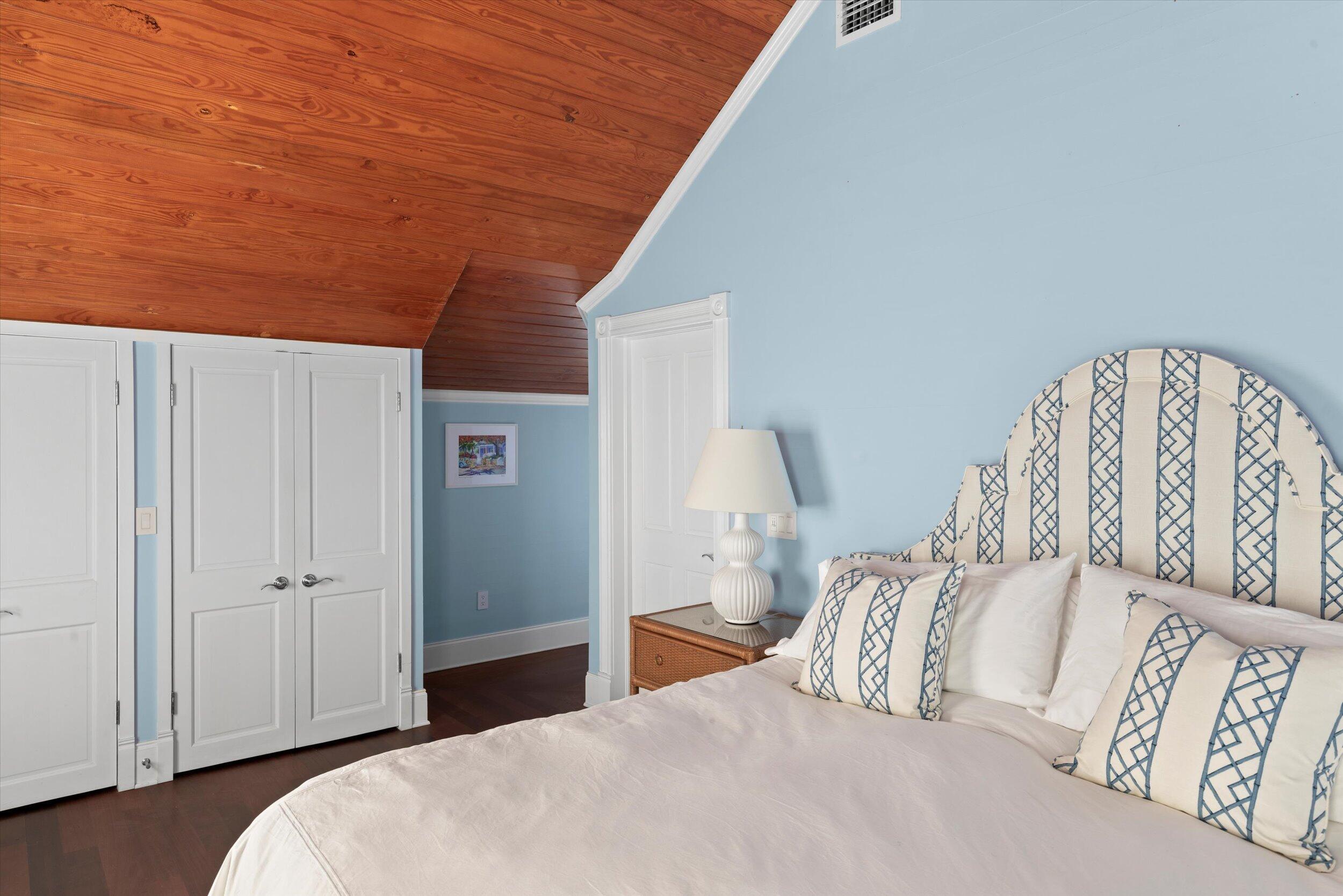 709 Eaton Street Key West, FL 33040 - Photo 29 of 37 a bedroom with a bed and a lamp
