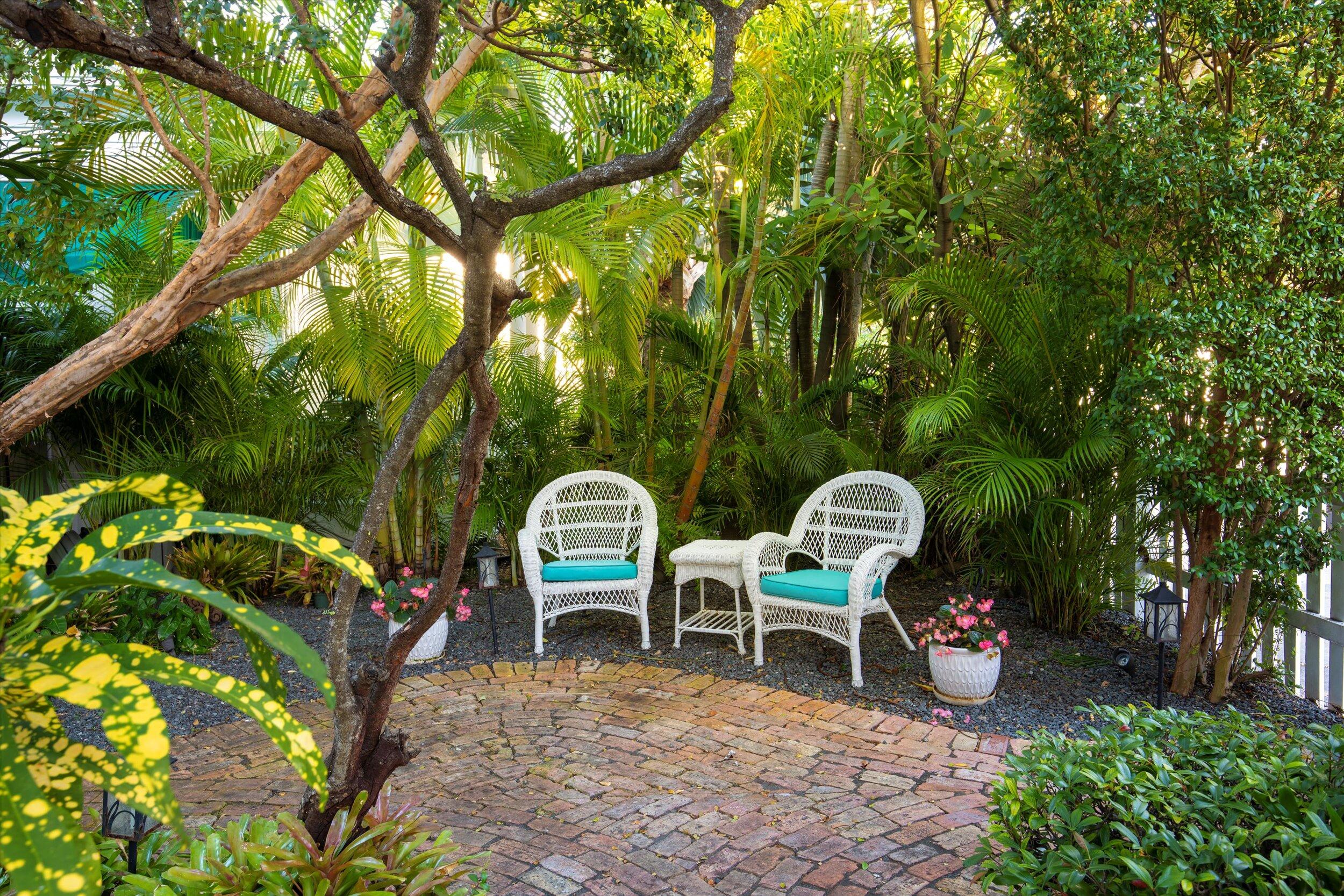 709 Eaton Street Key West, FL 33040 - Photo 35 of 37 a view of a chairs and table in backyard