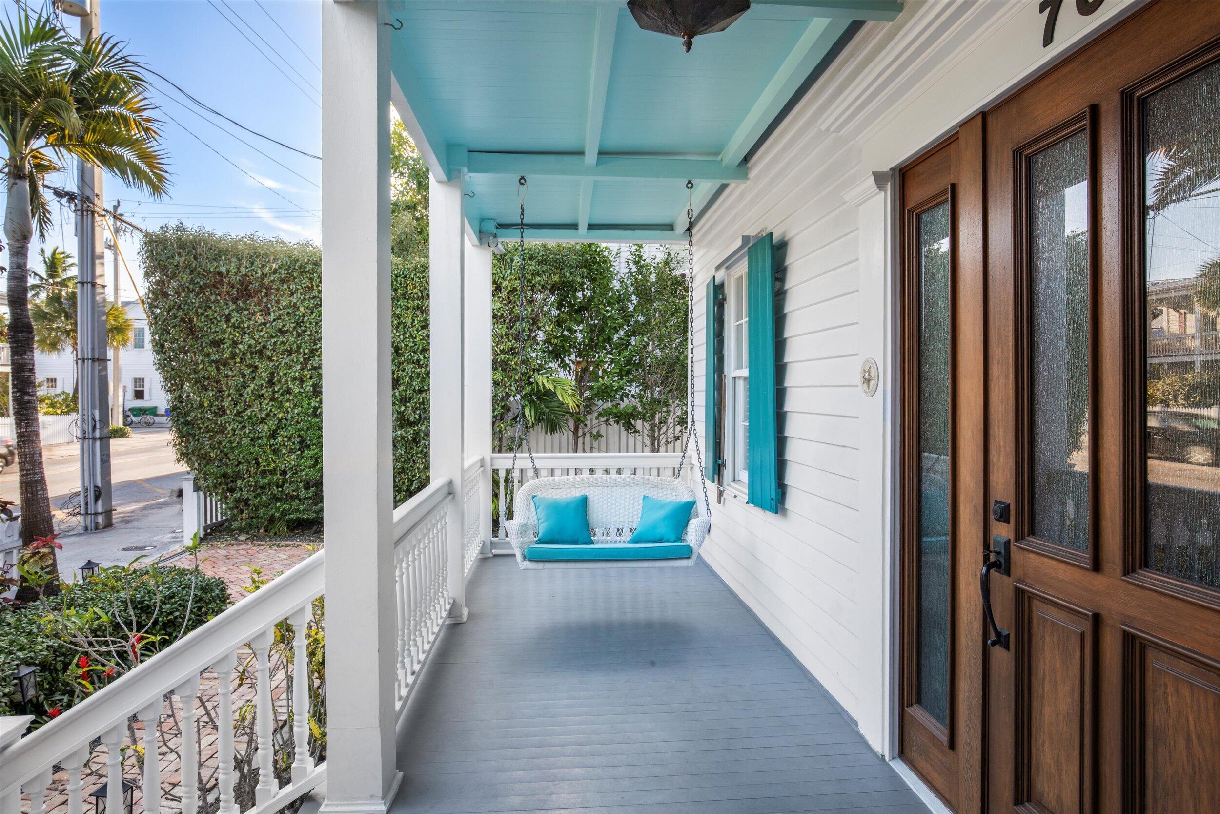 709 Eaton Street Key West, FL 33040 - Photo 35 of 37 a view of a house with porch and wooden floor