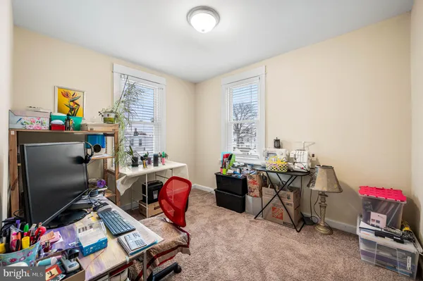 a workspace with furniture and a wooden floor
