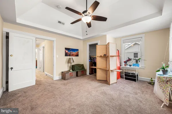 a kitchen with refrigerator and furniture