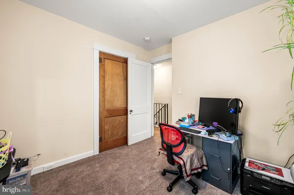 a room with furniture and air conditioner vent